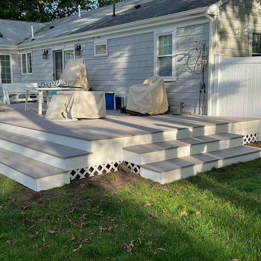 Finished composite deck with wraparound steps