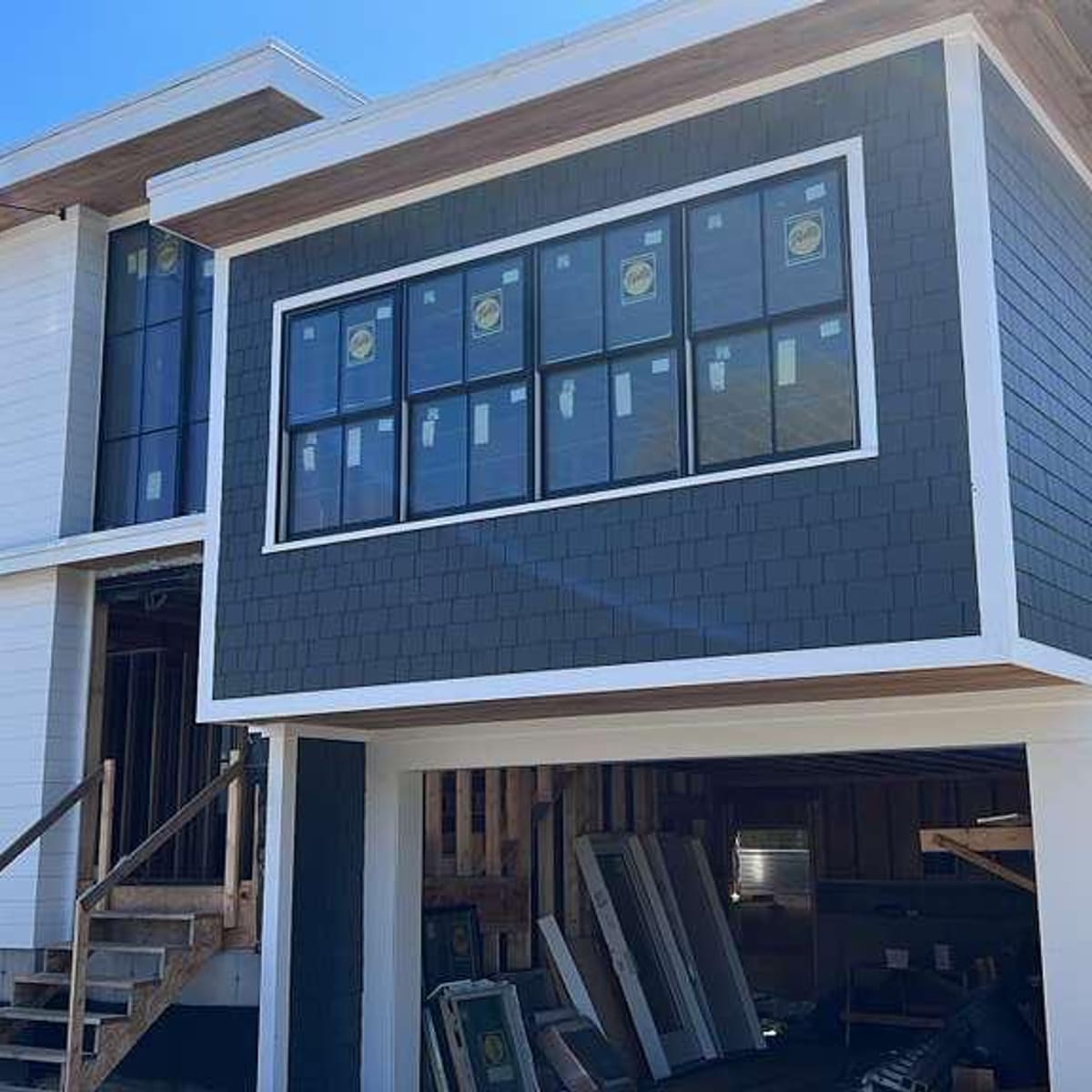 New window set into fresh cedar shingles