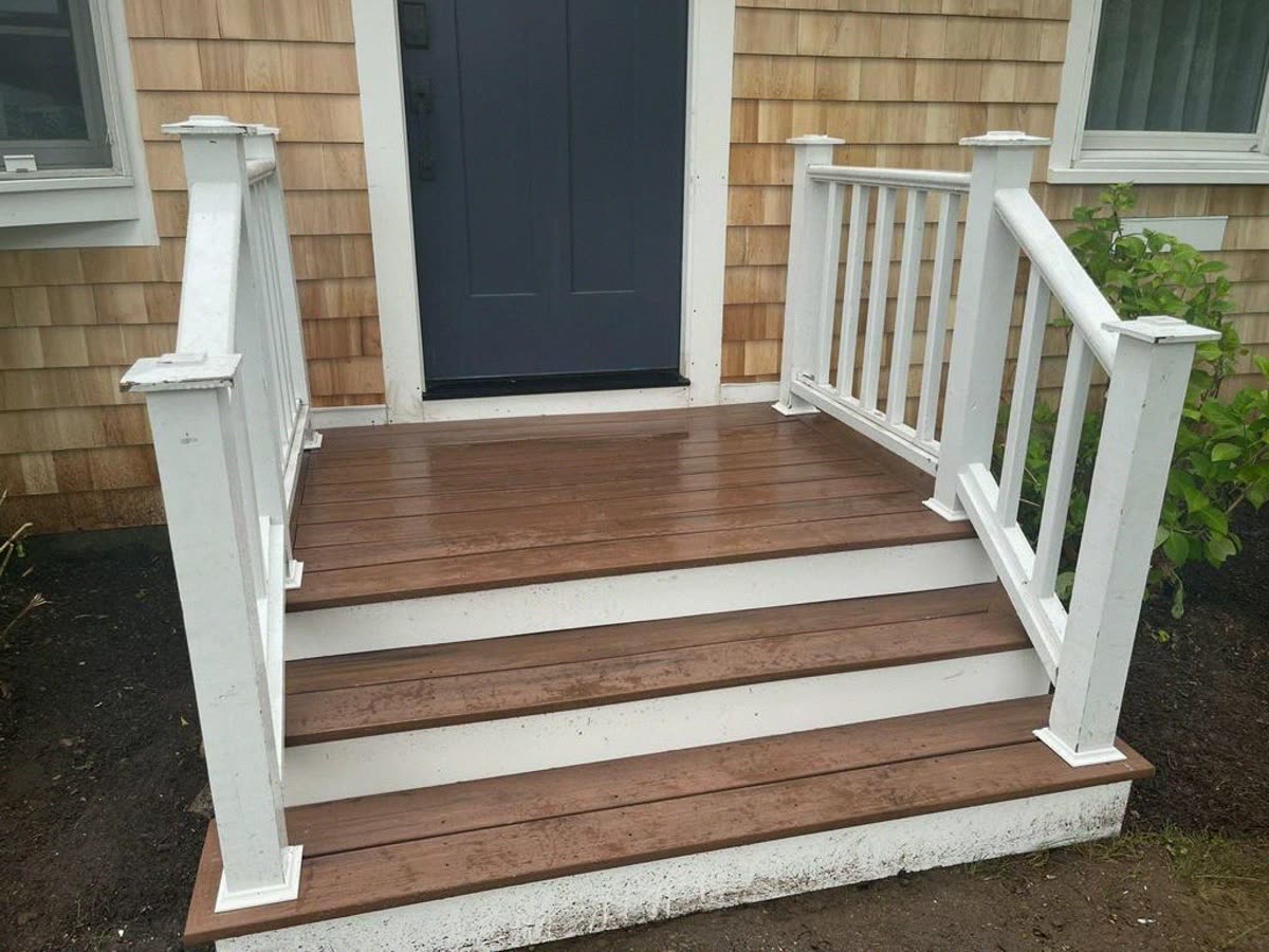 Composite entry steps with white posts and rails
